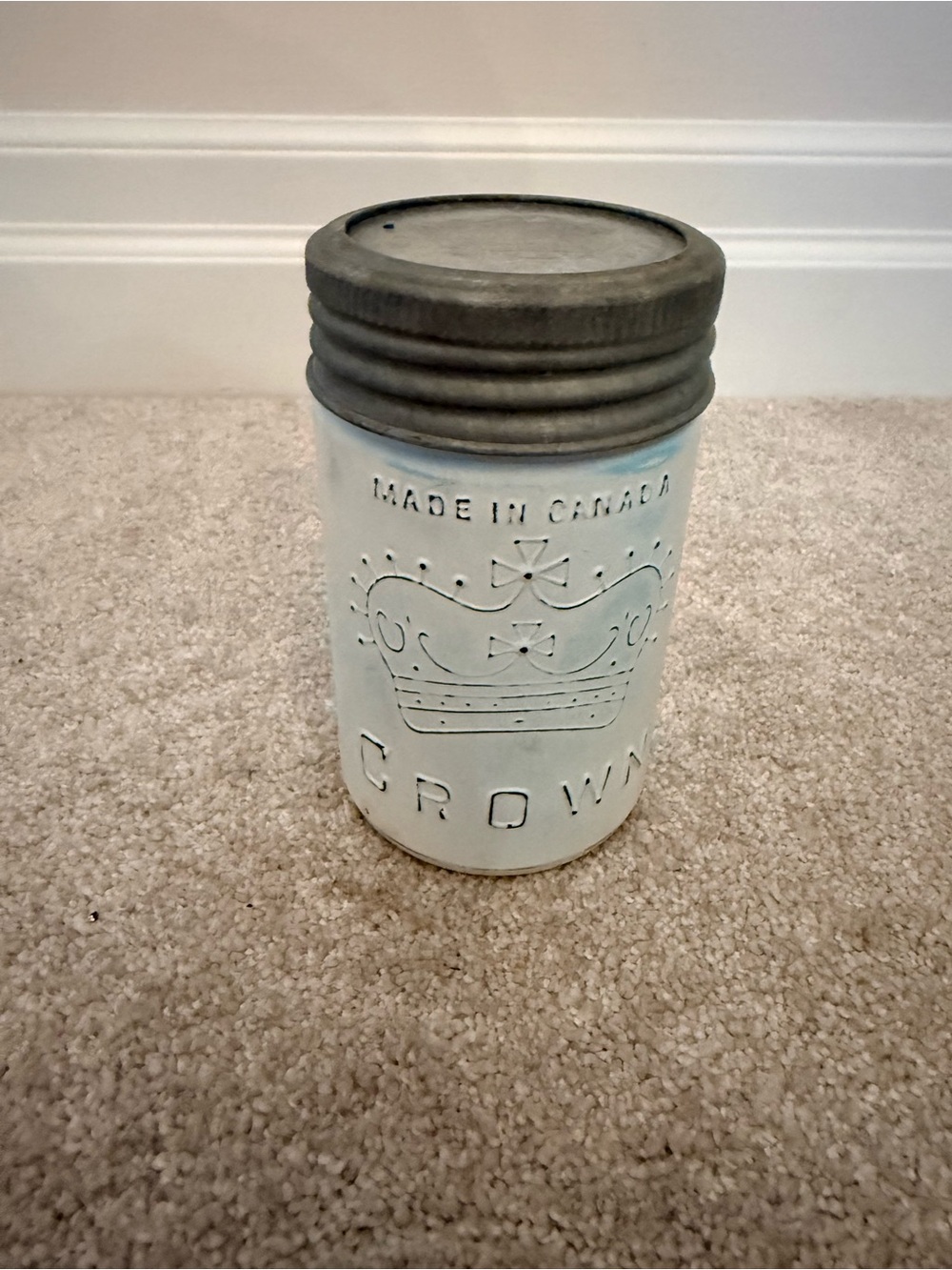 Crown Embossed Ceramic Jar with Metal Lid candle inside